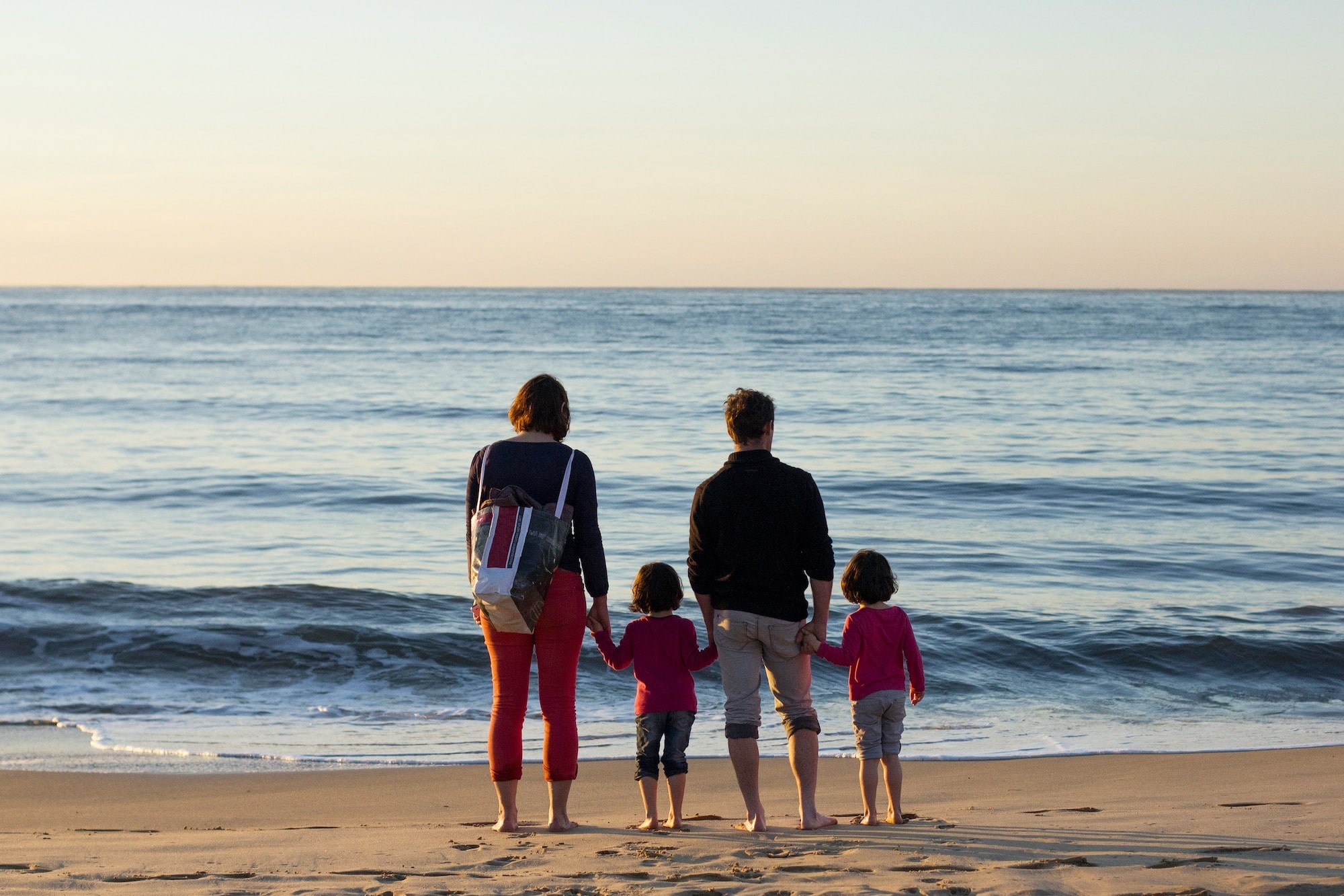 Family enjoying the beach — healthier lives